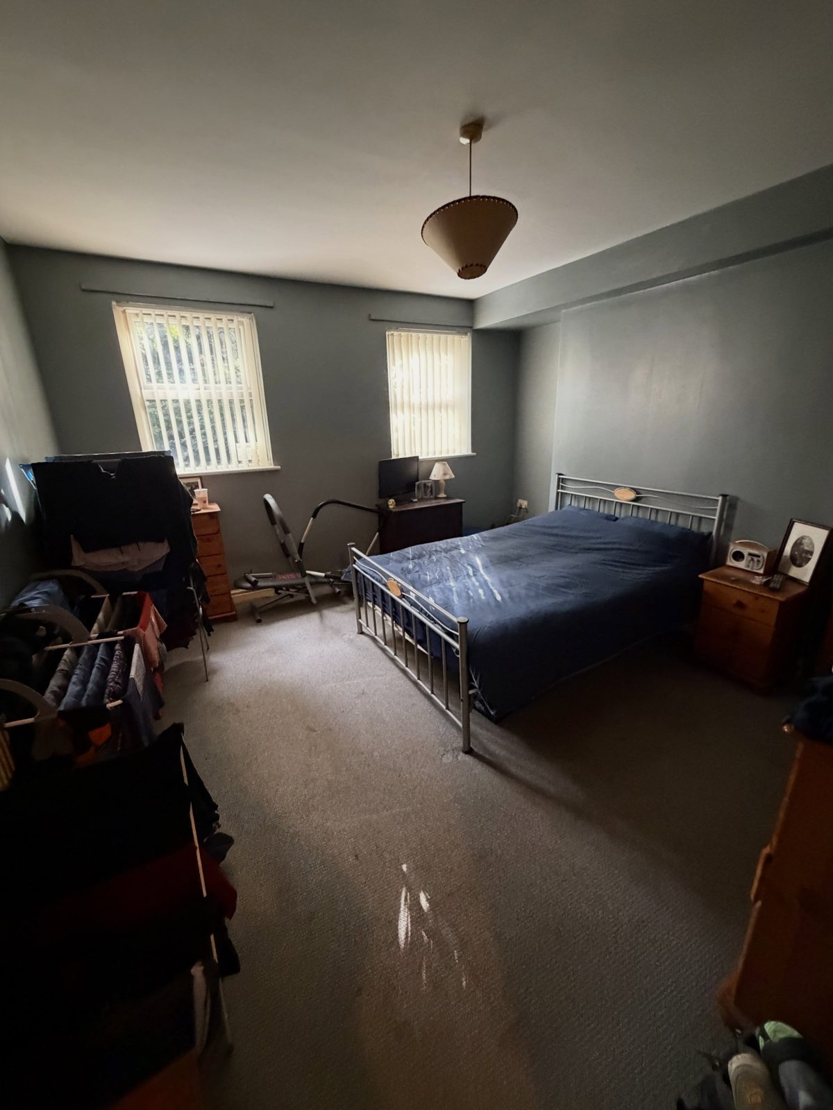 Vinny’s bedroom after a clean and organise, bed made and floor clear
