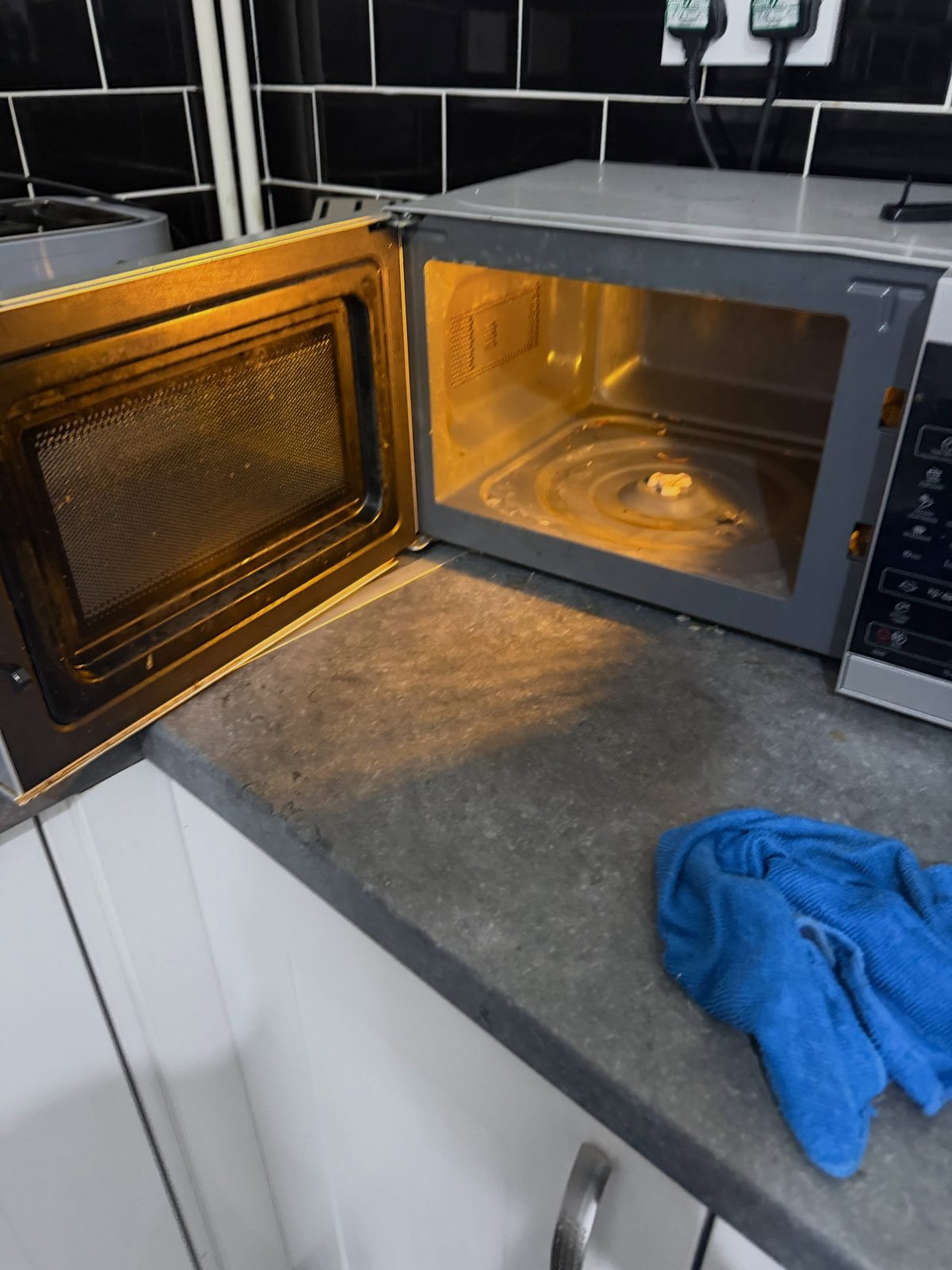 A dirty microwave interior before cleaning